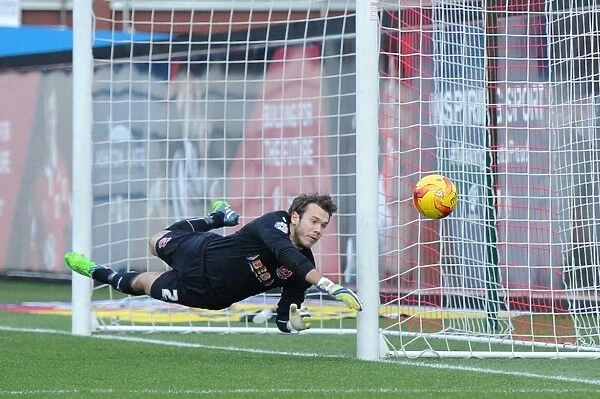 Diving for the Win: Intense Moment at Ashton Gate as Fleetwood Town's Chris Maxwell Reaches for the Ball in Bristol City vs Fleetwood Town Football Match, Sky Bet League One (January 2015)
