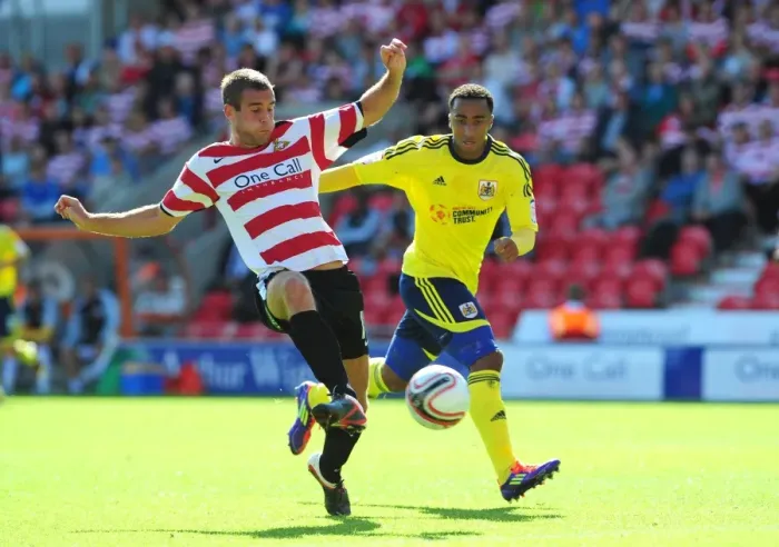 Framed Print : Doncaster's Spurr Clears Under Pressure from Maynard in Doncaster Rovers vs. Bristol City (League Cup, 2011) Framed Print : Doncaster's Spurr Clears Under Pressure from Maynard in Doncaster Rovers vs. Bristol City (League Cup, 2011)