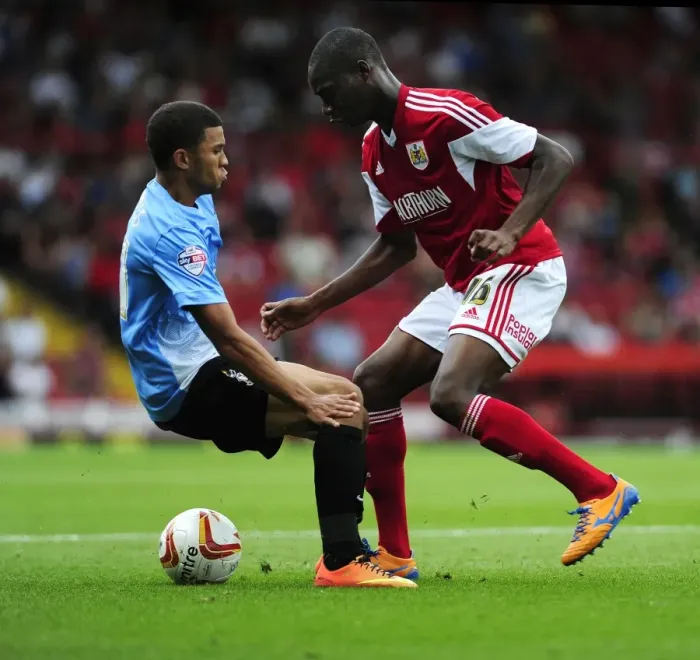 Framed Print : Escaping the Pressure: Jordan Wynter Evades Nahki Wells in Sky Bet League One Clash