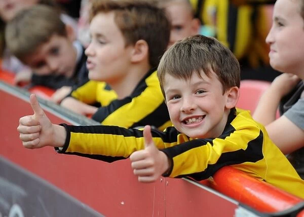 Euphoric Moment: A Passionate Bristol City Fan Celebrates at Ashton Gate