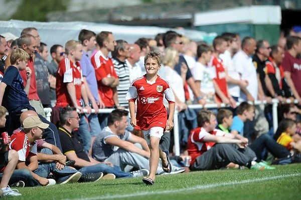 Excited Fan Chases Bristol City Players during Portishead Town Pre-Season Friendly