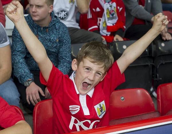 Exultant Bristol City Fan Celebrates at Ashton Gate