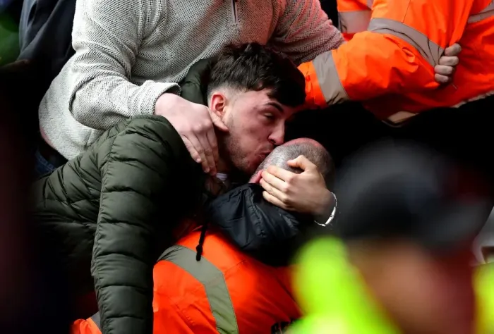 Framed Print : Exultant Cardiff Fan Embraces Steward Amidst Championship Clash: Bristol City vs Cardiff City (14 / 01 / 2017) Framed Print : Exultant Cardiff Fan Embraces Steward Amidst Championship Clash: Bristol City vs Cardiff City (14 / 01 / 2017)