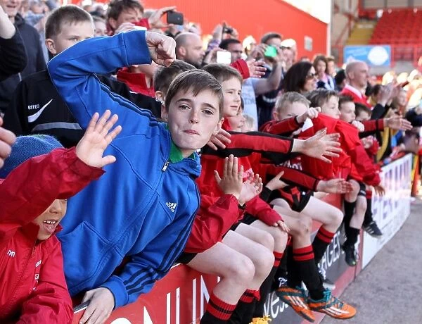 Exultant Young Fan Celebrates Bristol City's Promotion and Title Win