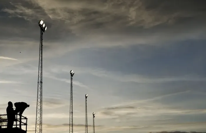 Framed Print : FA Cup Sunset: ITV Cameraman and Floodlights at Tamworth's The Lamb Ground