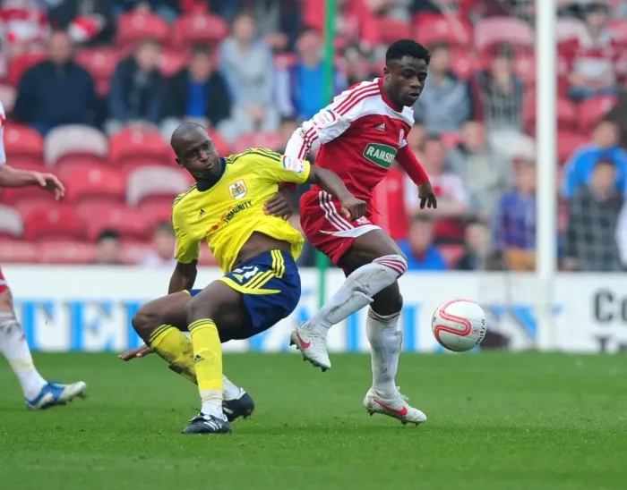 Framed Print : Football Rivalry: Cisse vs. Ogbeche at Riverside Stadium (2012) - Bristol City's Kalifa Cisse and Middlesbrough's Barthomew Ogbeche in a Tight Battle for the Ball Framed Print : Football Rivalry: Cisse vs. Ogbeche at Riverside Stadium (2012) - Bristol City's Kalifa Cisse and Middlesbrough's Barthomew Ogbeche in a Tight Battle for the Ball