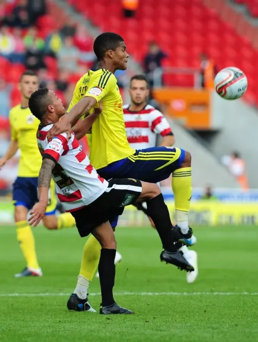 Framed Print : Football Rivalry: Jordan Spence vs. Kyle Bennett Clash in League Cup, 2011 - Doncaster Rovers vs. Bristol City