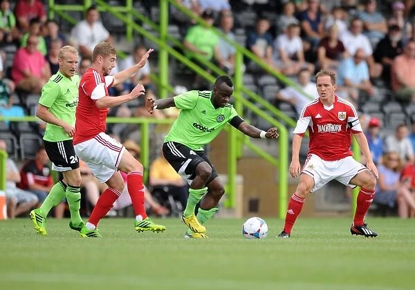 Forest Green Rovers Alhassan Bangura Outmaneuvers Bristol City's Steven Davis in Preseason Clash