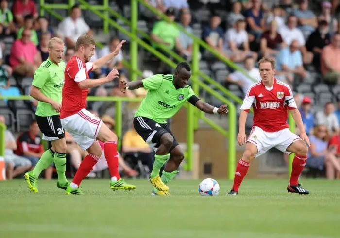 Framed Print : Forest Green Rovers Alhassan Bangura Outmaneuvers Bristol City's Steven Davis in Preseason Clash