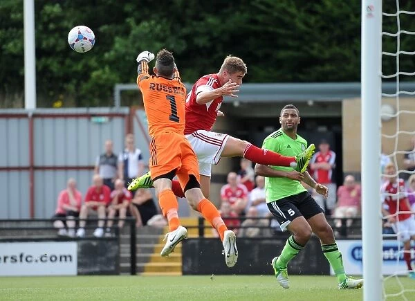 Forest Green Rovers Sam Russell Clears from Steven Davis in Preseason Clash vs. Bristol City