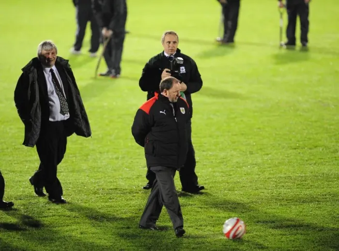 Framed Print : Gary Johnson checks the roll of the ball in pre pitch inspection