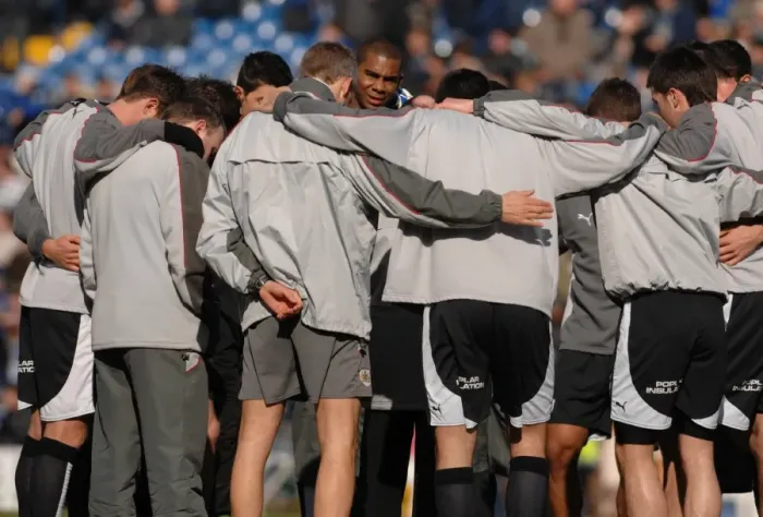 Framed Print : Gary Johnson gathers the team for a pre match huddle