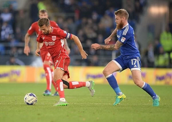 Gary O'Neil Charges Forward Amidst Aron Gunnarsson's Defensive Pressure - Cardiff City vs. Bristol City, Sky Bet Championship