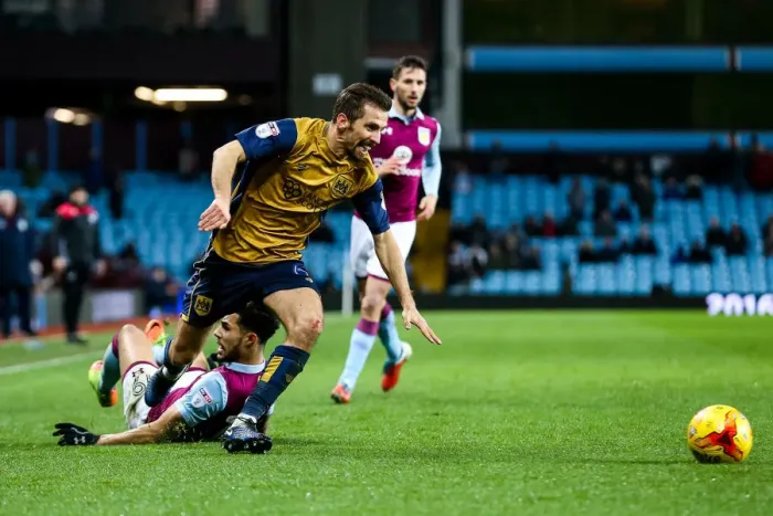 Framed Print : Gary O'Neil vs. Andre Green Clash at Villa Park: Aston Villa vs. Bristol City, Sky Bet EFL Championship