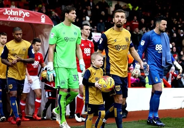 Gary O'Neil and Young Mascot Lead Bristol City Out at The City Ground