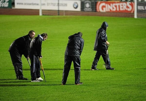 Groundsman work hard to make sure the pitch is playable