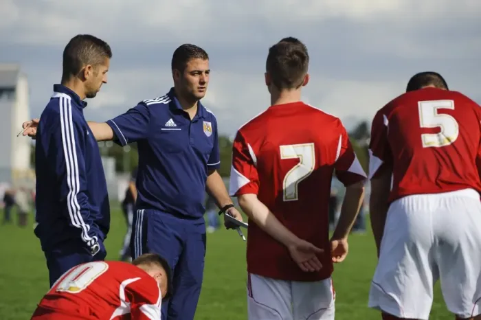 Framed Print : Half-Time Motivation: Carlos Anton and Alex Russell Rally Young Bristol City Players