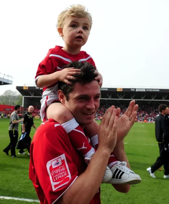 Framed Print : A Heartwarming Moment: Ivan Sproule of Bristol City Shares the Pitch with His Son during the 2010 Championship Match against Derby County Framed Print : A Heartwarming Moment: Ivan Sproule of Bristol City Shares the Pitch with His Son during the 2010 Championship Match against Derby County