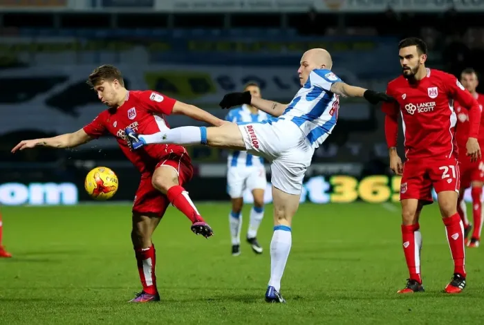 Framed Print : Huddersfield's Aaron Mooy Challenges Luke Freeman in Intense Sky Bet Championship Clash Framed Print : Huddersfield's Aaron Mooy Challenges Luke Freeman in Intense Sky Bet Championship Clash