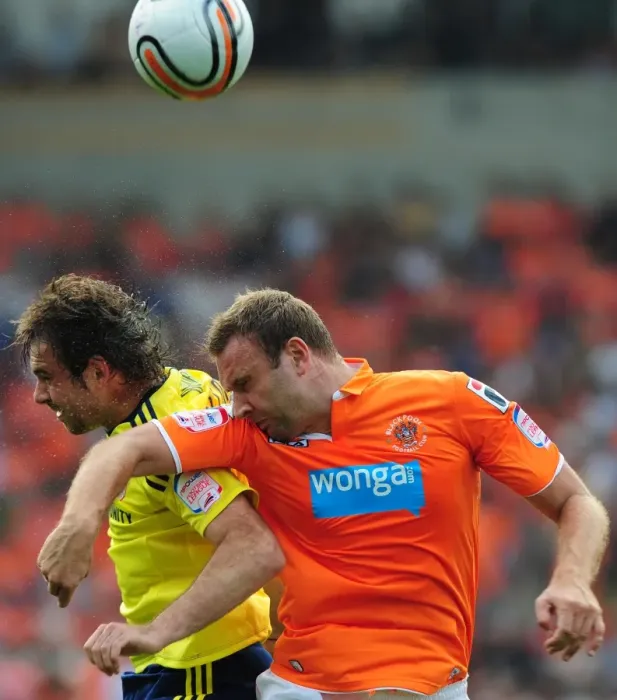 Framed Print : Ian Evatt Leaps Above Brett Pitman: Blackpool's League Cup Upset over Bristol City (1st October 2011)