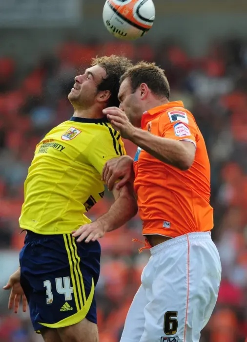 Framed Print : Ian Evatt Outjumps Brett Pitman in Blackpool's League Cup Victory over Bristol City (1st October 2011) Framed Print : Ian Evatt Outjumps Brett Pitman in Blackpool's League Cup Victory over Bristol City (1st October 2011)