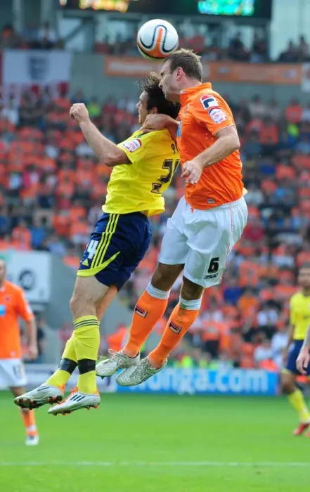 Framed Print : Ian Evatt Wins the Ball Over Brett Pitman in Blackpool vs. Bristol City League Cup Clash - 01 / 10 / 2011