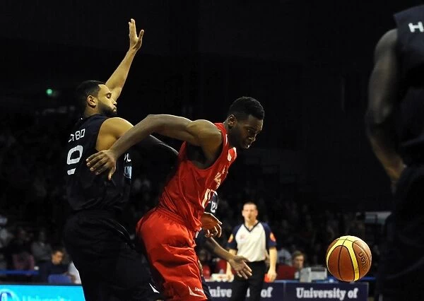 Intense Action: Alif Bland of Bristol Flyers vs. Wolves Defense during British Basketball League Cup Match