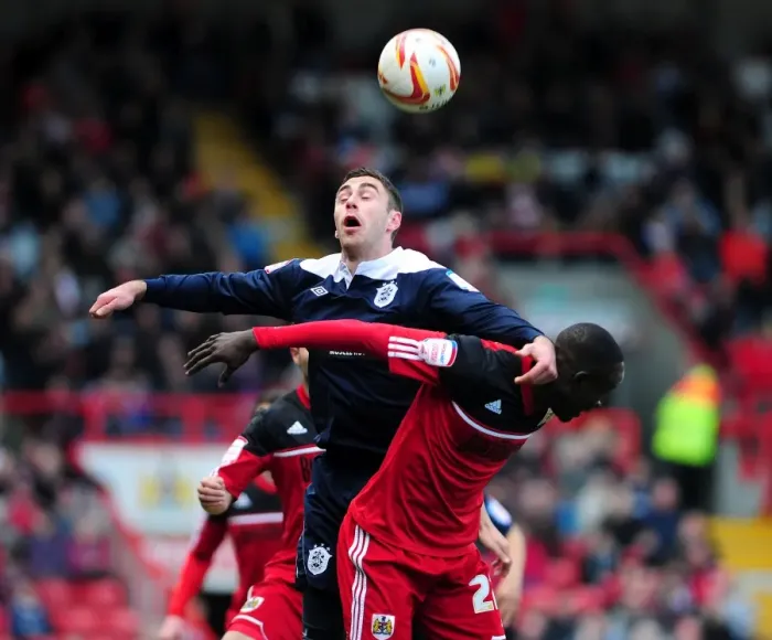 Framed Print : Intense Aerial Battle: Albert Adomah vs Lee Novak - Bristol City vs Huddersfield Town Football Match Framed Print : Intense Aerial Battle: Albert Adomah vs Lee Novak - Bristol City vs Huddersfield Town Football Match