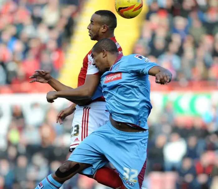 Framed Print : Intense Aerial Clash: Tyrone Barnett vs Stephen Arthurworrey in Bristol City vs Tranmere Rovers Football Match Framed Print : Intense Aerial Clash: Tyrone Barnett vs Stephen Arthurworrey in Bristol City vs Tranmere Rovers Football Match