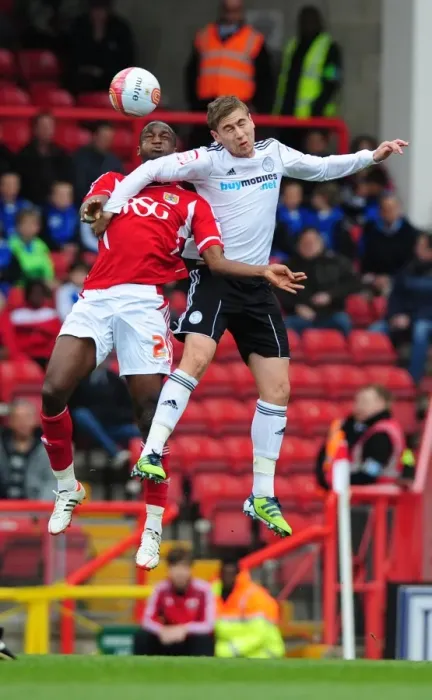 Framed Print : Intense Aerial Clash: Cisse vs. Davies at Ashton Gate