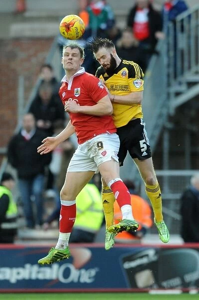 Intense Aerial Clash: Matt Smith vs John Brayford in Bristol City vs Sheffield United