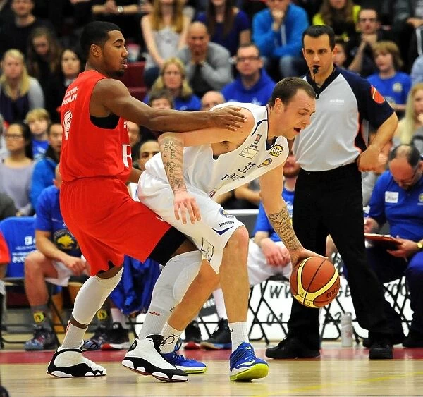 Intense Basketball Clash: Dwayne Lautier-Ogunleye of Bristol Flyers in Action