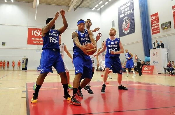 Intense Basketball Clash: Greg Streete Fights for Control between Bristol Flyers and Plymouth Raiders