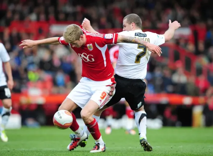 Framed Print : Intense Battle: Jon Stead vs Stephen Dawson - Bristol City vs Barnsley Football Match, Ashton Gate Stadium, 2012