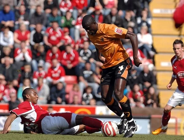 Intense Battle: Marvin Elliott Fights for Ball Against Wolverhampton Wanderers