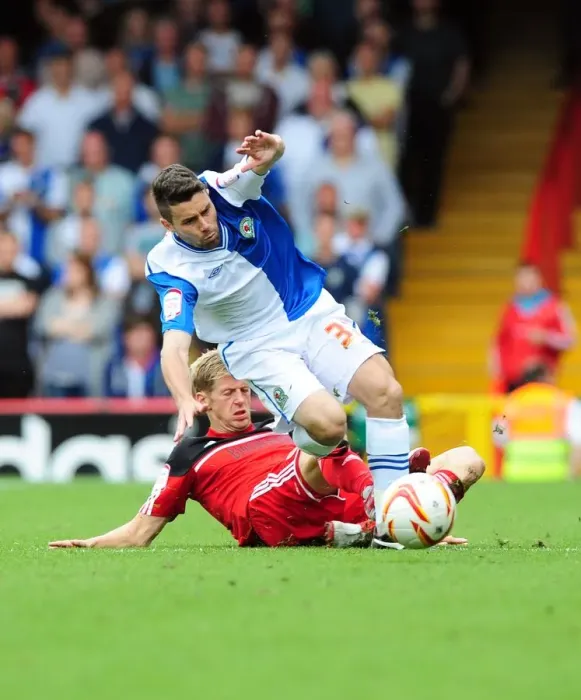 Framed Print : Intense Championship Clash: Jon Stead vs. Bruno Ribeiro - A Hard-Fought Tackle