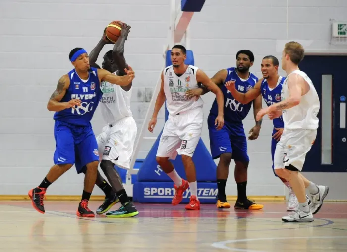 Framed Print : Intense Defense: Greg Streete of Bristol Flyers Blocks Nicholas George of Plymouth Raiders