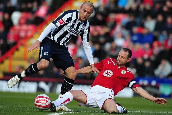 Intense Football Championship Clash: Louis Carey Tackles Roman Bednal - Bristol City vs. West Bromwich Albion, 2010