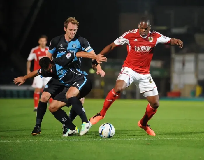 Framed Print : Intense Football Rivalry: Bristol City vs Wycombe Wanderers in the Johnstone's Paint Trophy Clash at Adams Park (October 8, 2013)