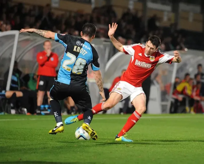 Framed Print : Intense Football Rivalry: Bristol City vs Wycombe Wanderers in the Johnstone's Paint Trophy Clash at Adams Park (October 8, 2013)