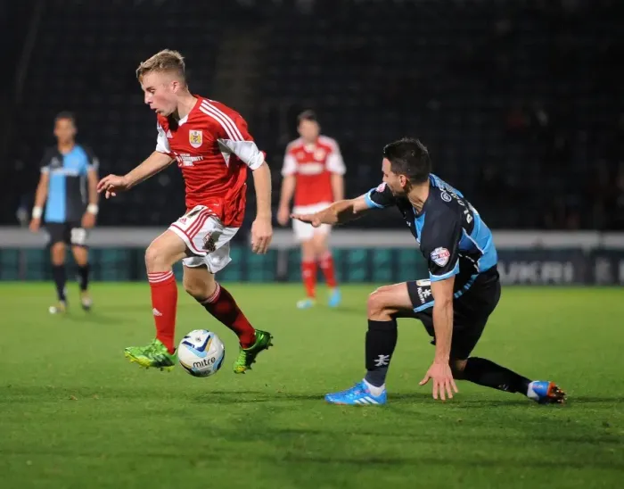 Framed Print : Intense Football Rivalry: Bristol City vs Wycombe Wanderers in the Johnstone's Paint Trophy Clash at Adams Park (October 8, 2013)