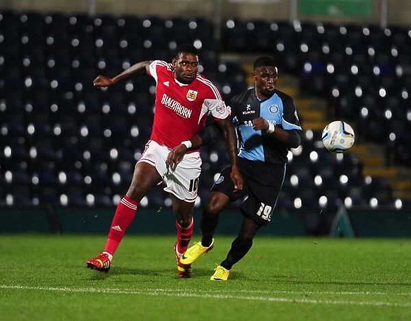 Intense Football Rivalry: Bristol City vs Wycombe Wanderers in the Johnstone's Paint Trophy Clash at Adams Park (2013)