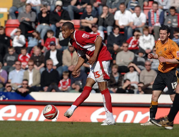 Intense Football Rivalry: Marvin Elliott Fights for Possession vs. Wolverhampton Wanderers