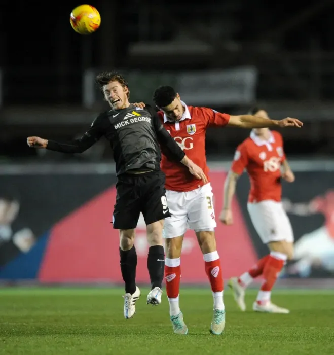 Framed Print : Intense Header Battle: Derrick Williams vs Luke James in Bristol City vs Peterborough United