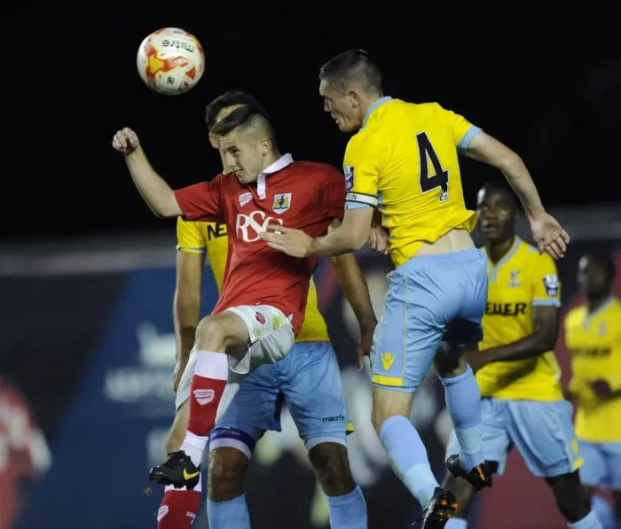 Framed Print : Intense Header Battle: Murphy vs. Dymond - Football Rivalry Unfolds at Ashton Gate Framed Print : Intense Header Battle: Murphy vs. Dymond - Football Rivalry Unfolds at Ashton Gate