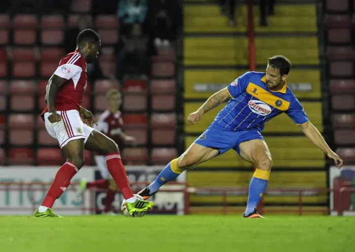 Framed Print : Intense League One Clash: Jay Emmanuel-Thomas Tackled at Ashton Gate Framed Print : Intense League One Clash: Jay Emmanuel-Thomas Tackled at Ashton Gate