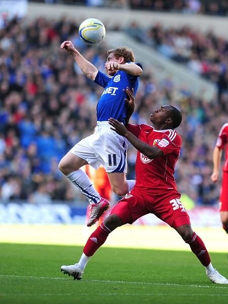 Intense Moment: Burke vs. Rose in Npower Championship Clash at Cardiff City Stadium (16 / 10 / 2010)