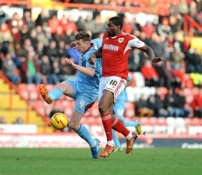 Framed Print : Intense Moment: Jay Emmanuel-Thomas Chases Down Ash Taylor during Bristol City vs Tranmere Rovers