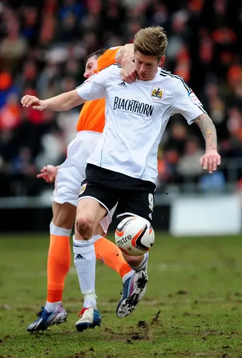 Framed Print : Intense Moment: Jon Stead vs Kirk Broadfoot Clash in Bristol City vs Blackpool Npower Championship Match, 2013