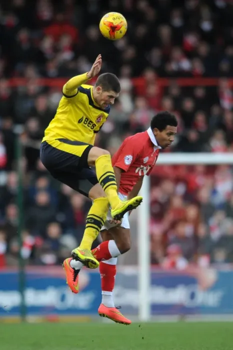 Framed Print : Intense Moment: Korey Smith vs. Jamie Proctor Head-to-Head Clash during Bristol City vs. Fleetwood Town, Sky Bet League One (January 2015)